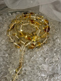 Close-up of natural amber beads with unique texture and polished surface – premium handmade prayer rosary.