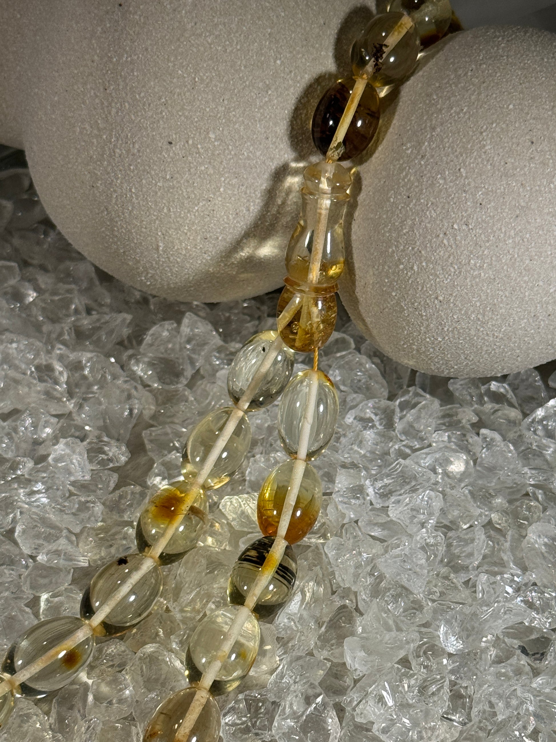 Close-up of natural amber beads with unique texture and polished surface – premium handmade prayer rosary