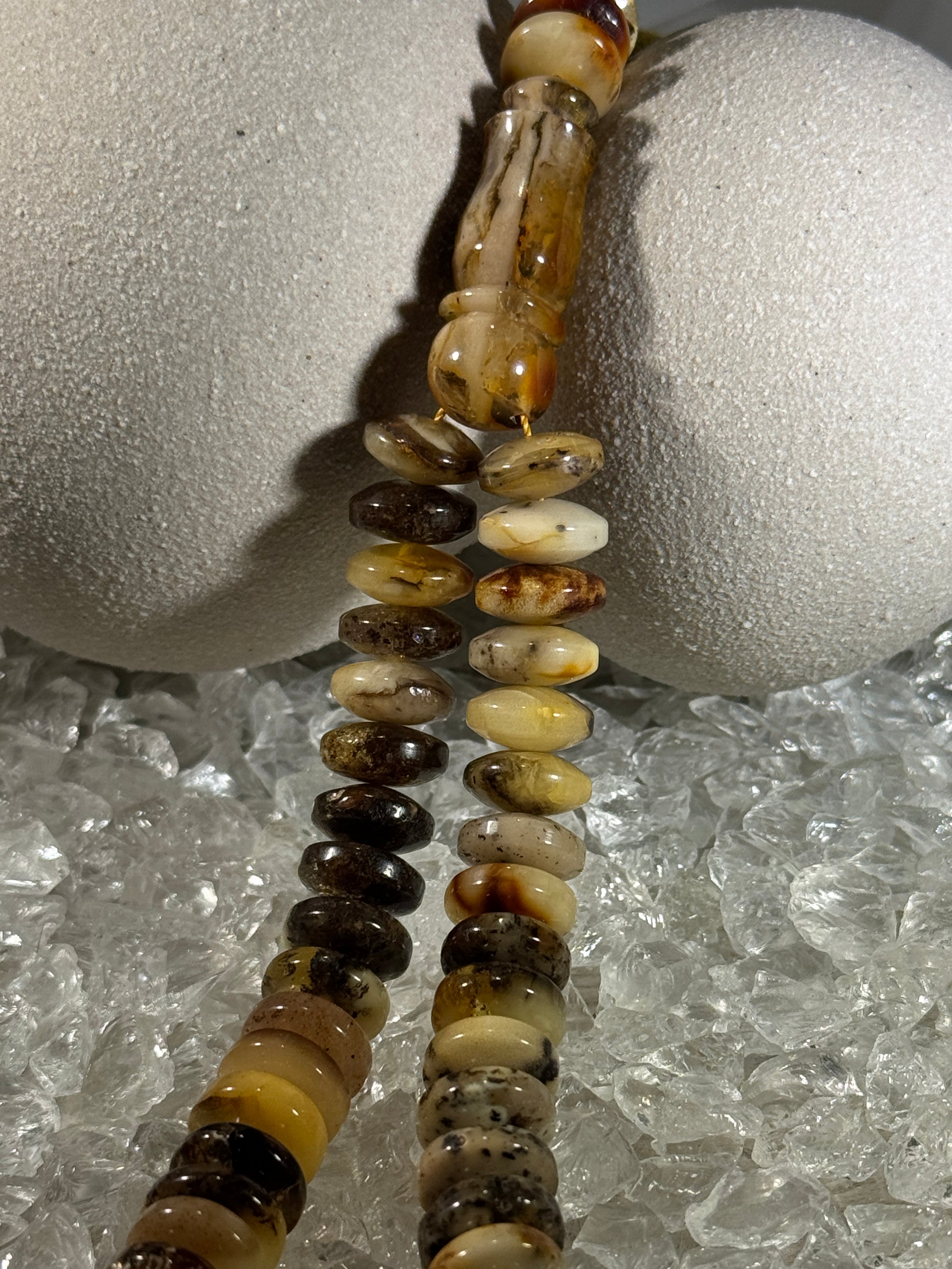 Close-up of natural amber beads with unique texture and polished surface – premium handmade prayer rosary