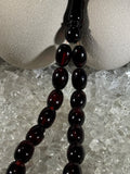Close-up of natural amber beads with unique texture and polished surface – premium handmade prayer rosary