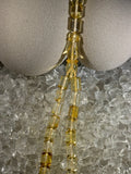 Close-up of natural amber beads with unique texture and polished surface – premium handmade prayer rosary
