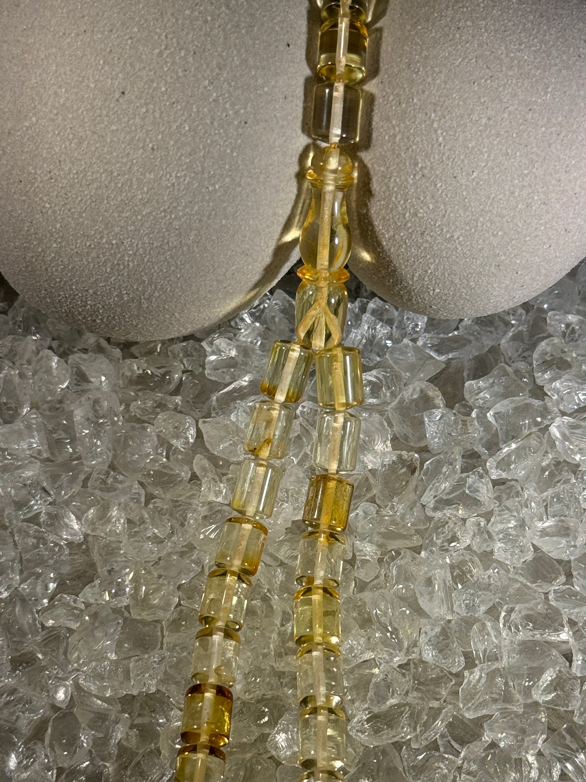 Close-up of natural amber beads with unique texture and polished surface – premium handmade prayer rosary