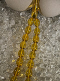 Close-up of natural amber beads with unique texture and polished surface – premium handmade prayer rosary