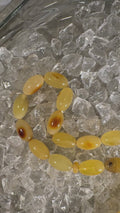 Elegant amber tasbih displayed for Islamic prayer and meditation – handmade misbaha collector’s gift.