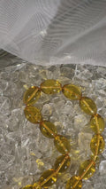 Elegant amber tasbih displayed for Islamic prayer and meditation – handmade misbaha collector’s gift.