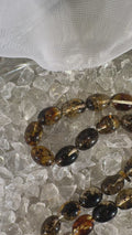 Elegant amber tasbih displayed for Islamic prayer and meditation – handmade misbaha collector’s gift